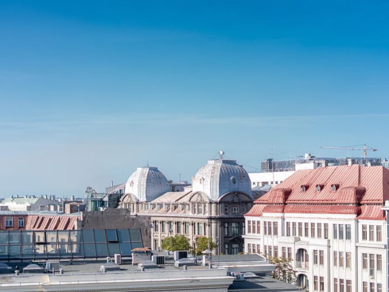 Aerial view of Riga, Latvia, showcasing historic rooftops and clear blue sky.