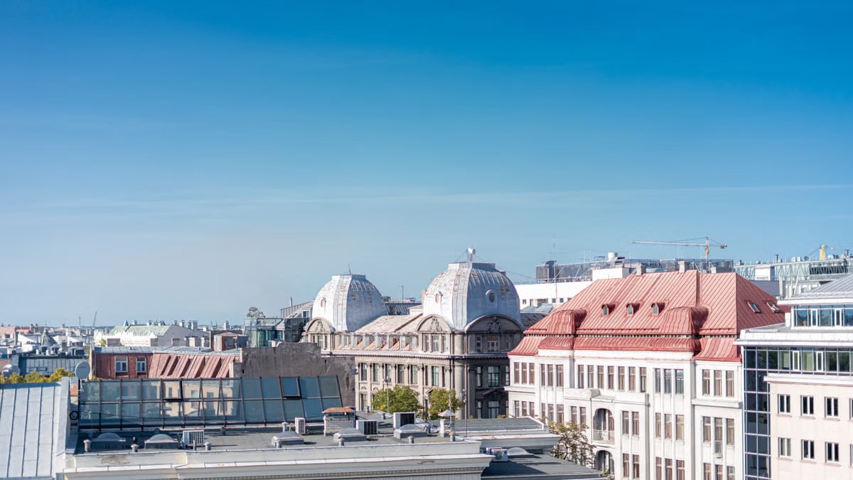 Aerial view of Riga, Latvia, showcasing historic rooftops and clear blue sky.